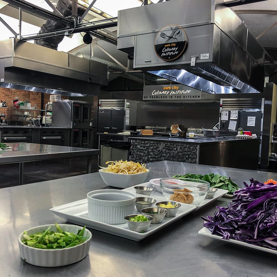 The Park City Culinary Institute teaching kitchen, featuring state-of-the-art stainless steel appliances.