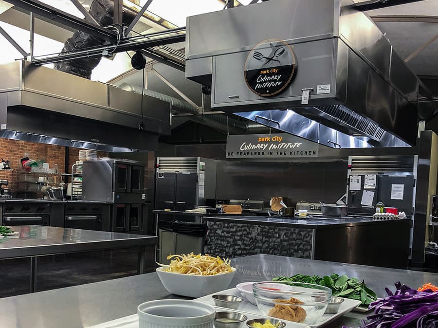 The Park City Culinary Institute teaching kitchen, with stainless steel appliances and skylights.