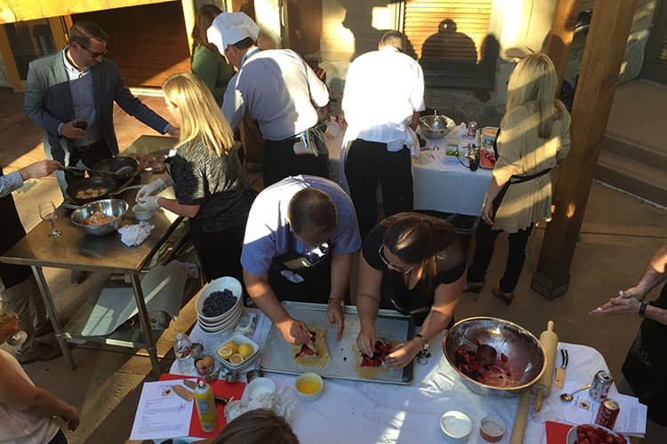 People attending a team-building event at Park City Culinary Institute.