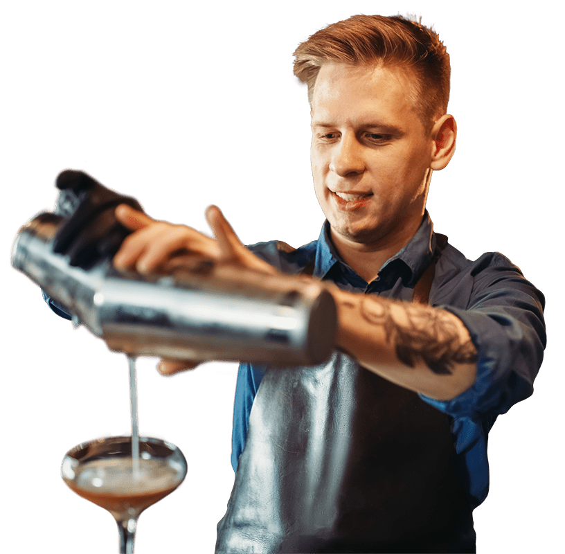 Bartender pouring a cocktail from a shaker.